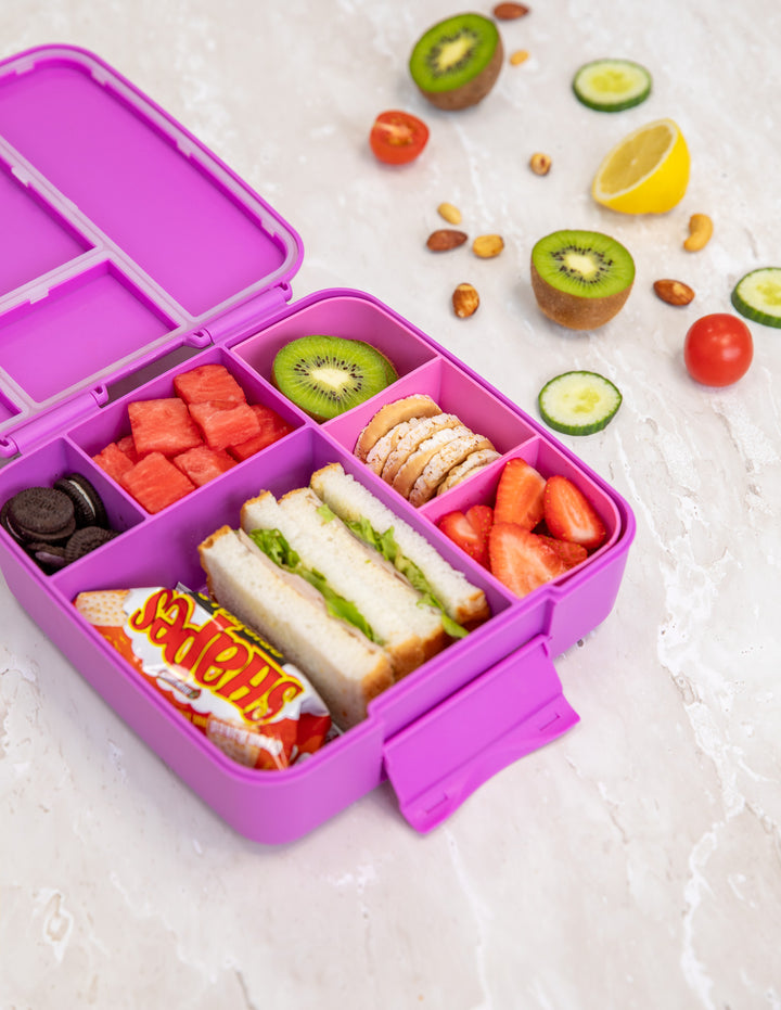 MontiiCo Feast Lunch Box - Fuchsia open lunch box with compartments and snacks