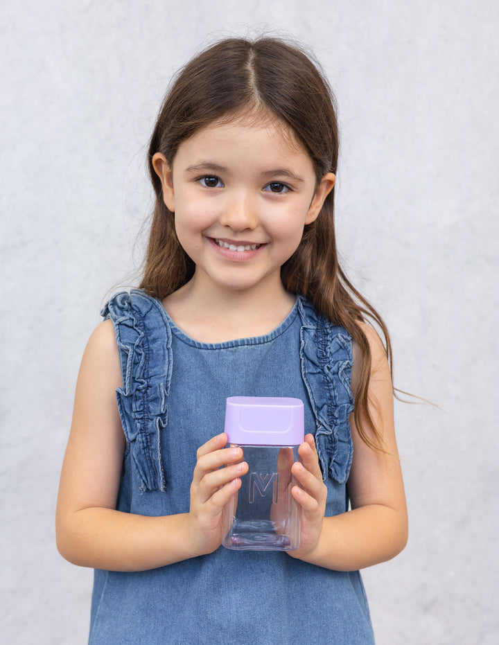 MontiiCo Bento Bottle - Lilac child holding the bottle