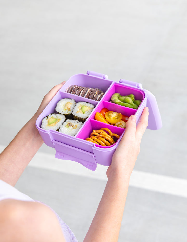 MontiiCo Bite Lunch Box - Lilac open lunch box with compartments and snacks