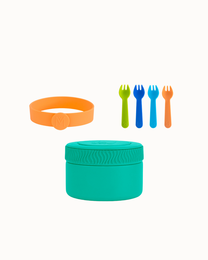 Set of colorful silicone utensils and container on a white background