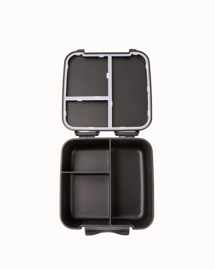 Black bento box with compartments on a white background
