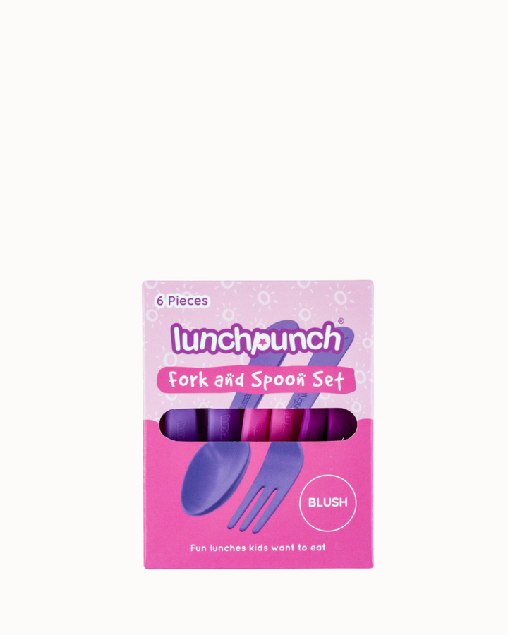 Pink packaging of lunchpunch fork and spoon set with purple cutlery on a white background