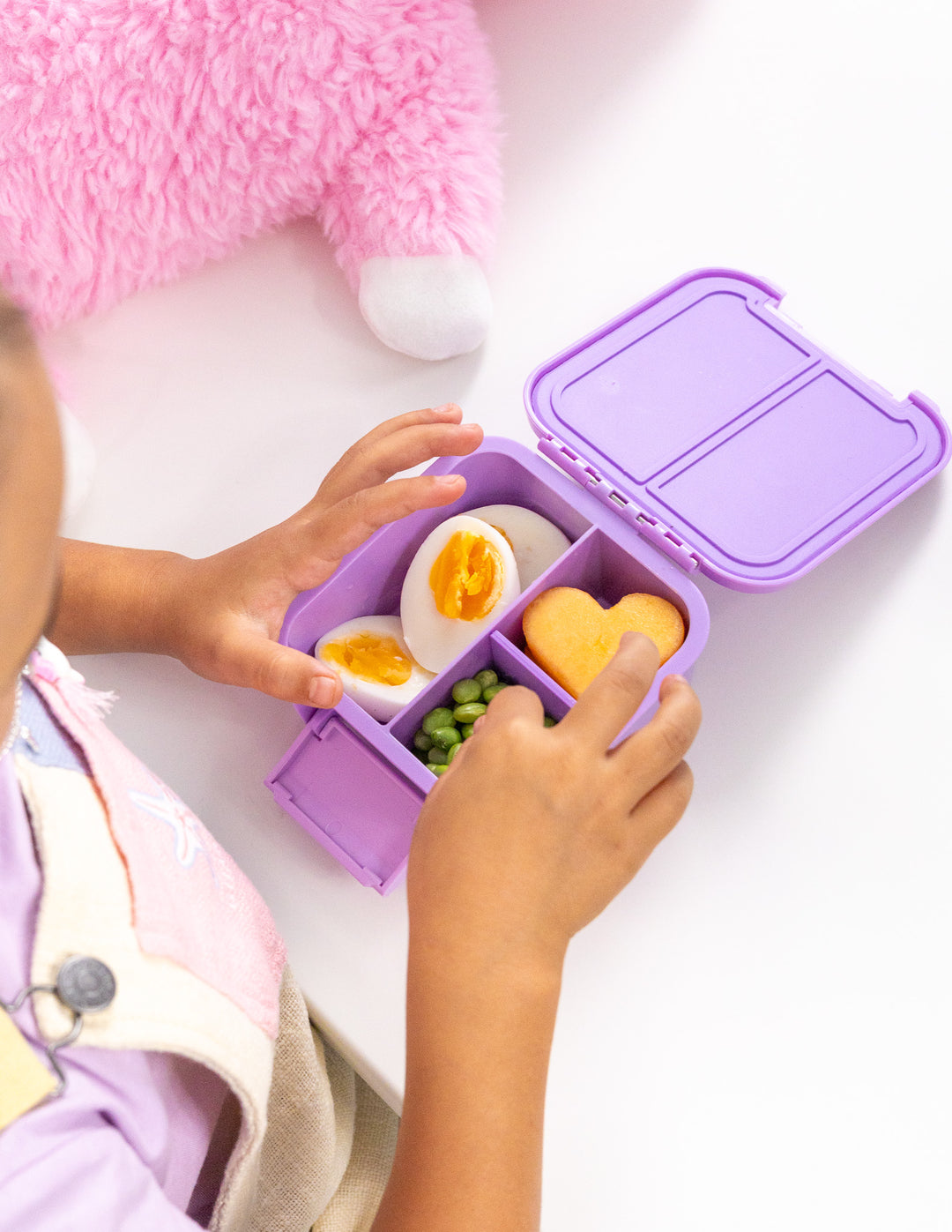 MontiiCo Bento Two - Unicorn child picking up snacks inside