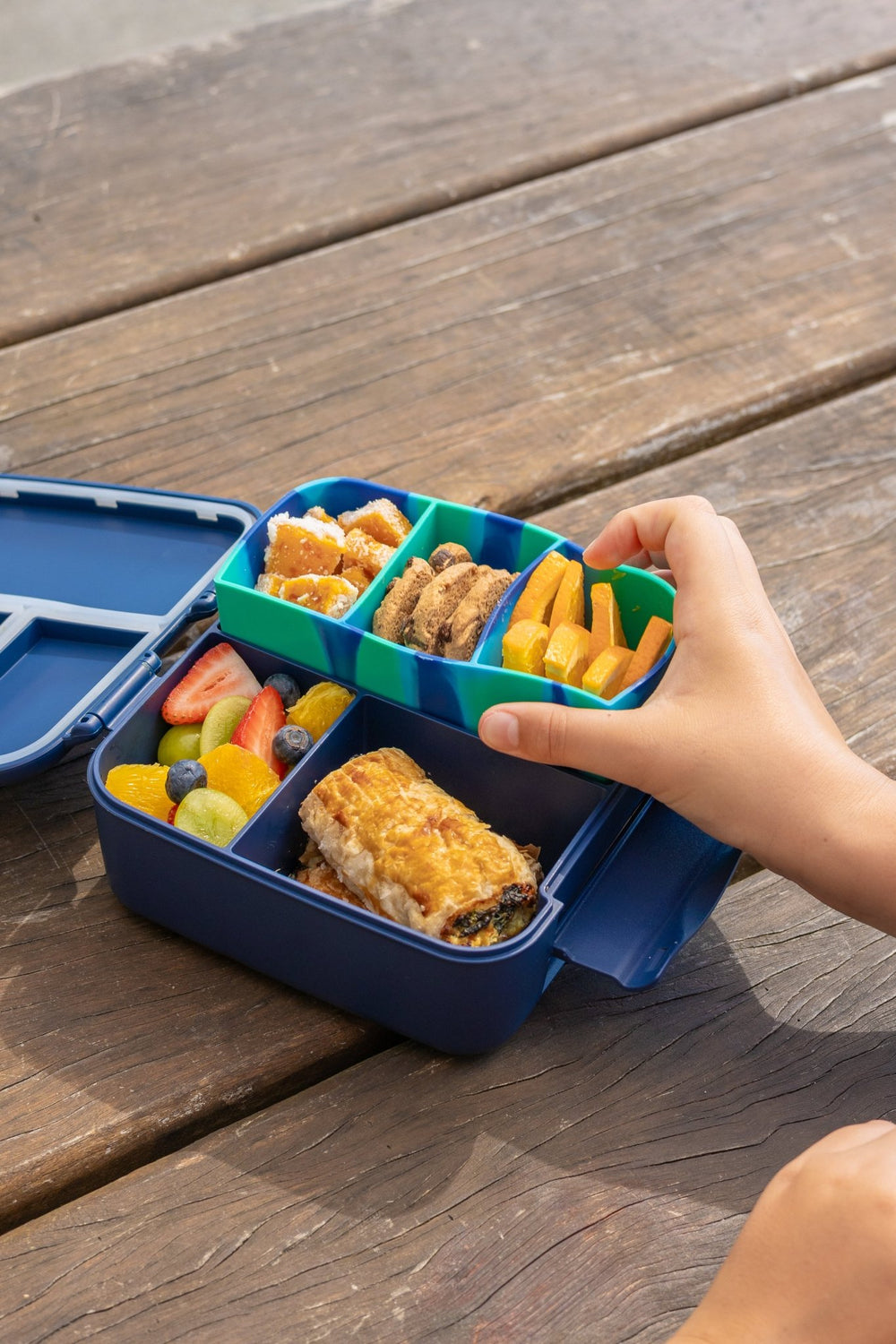 MontiiCo Bite Tray - Coastal Marble filled with different snacks inside bite lunch box