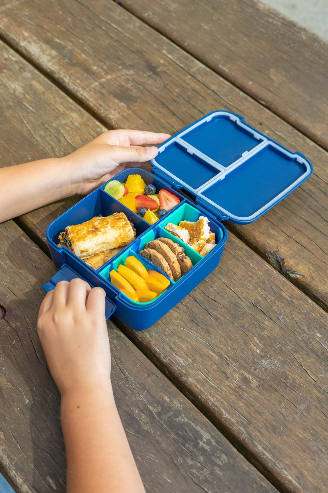 MontiiCo Bite Tray - Coastal Marble filled with different snacks inside bite lunch box