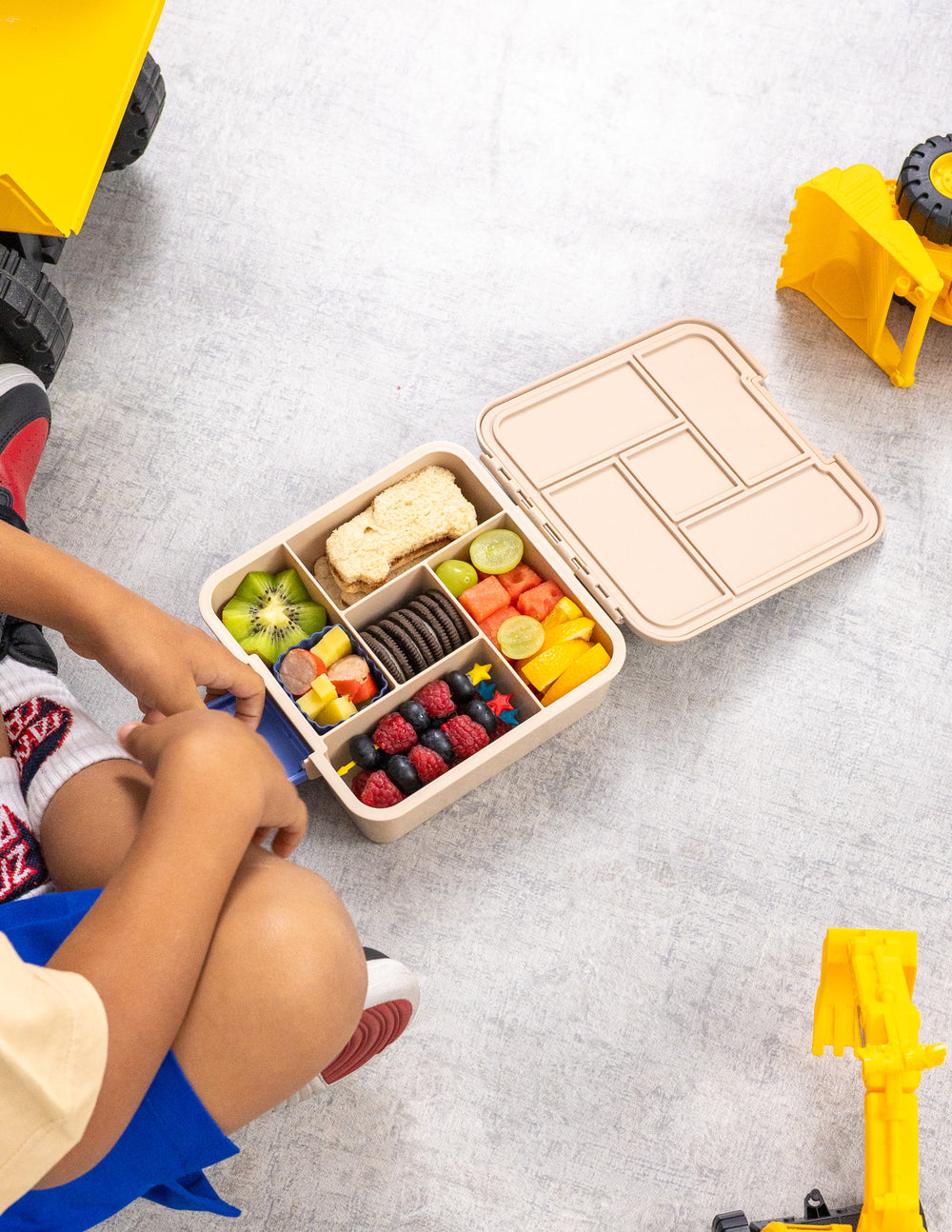 MontiiCo Bento Five - Construction filled with fruit and snacks