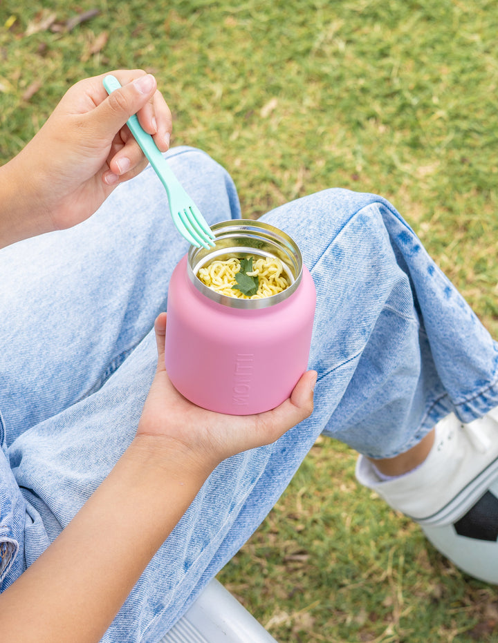 Child holding thermos lunch pot for school lunch