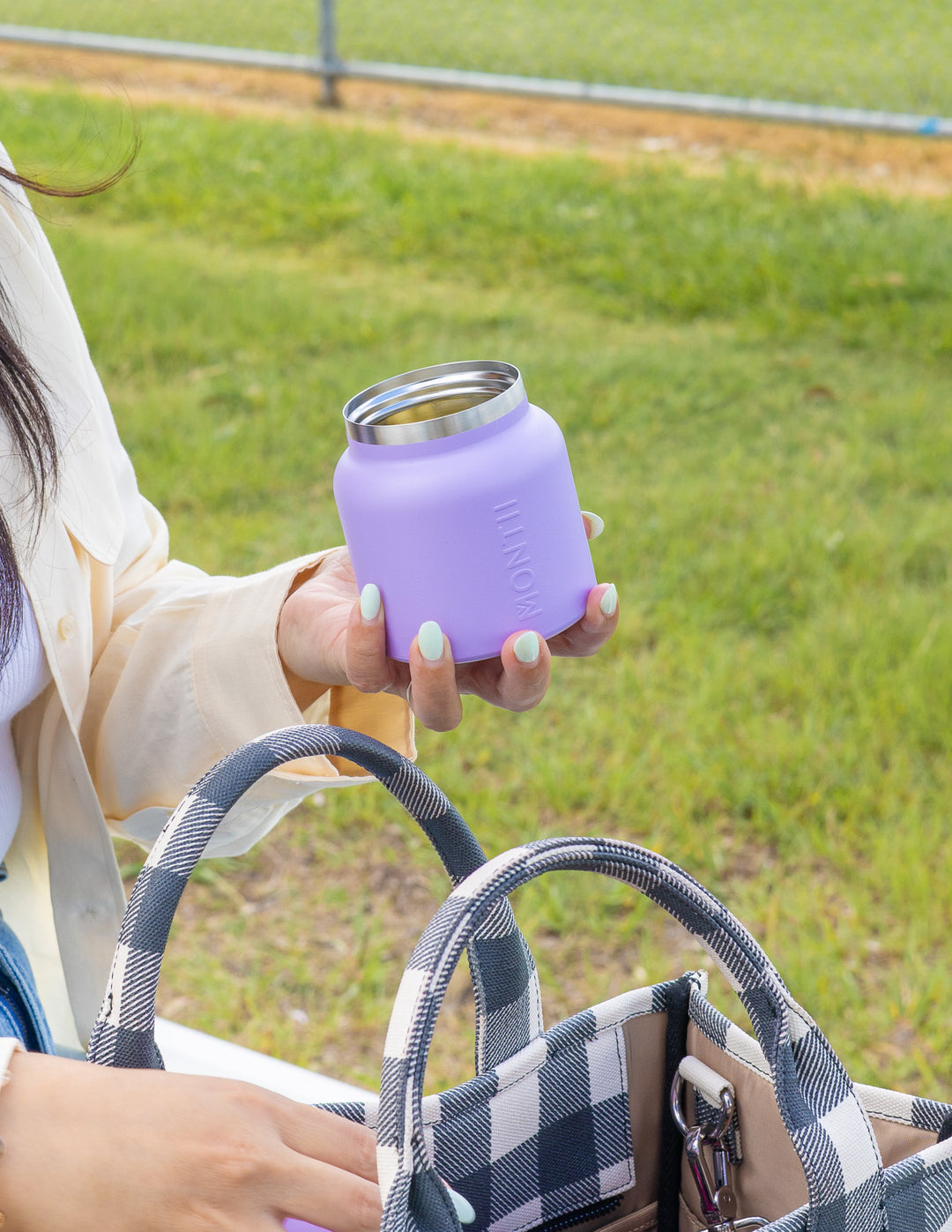 Portable snack pot thermos inside bag on the go