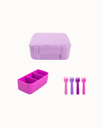 Purple lunch box with pink dividers and forks on a white background
